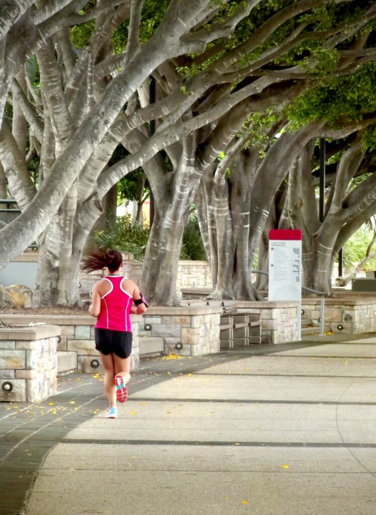 runner along Southbank, Brisbane walkway